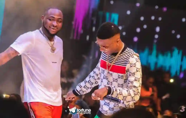 Davido, Wizkid hug out their differences at Lagos nightclub