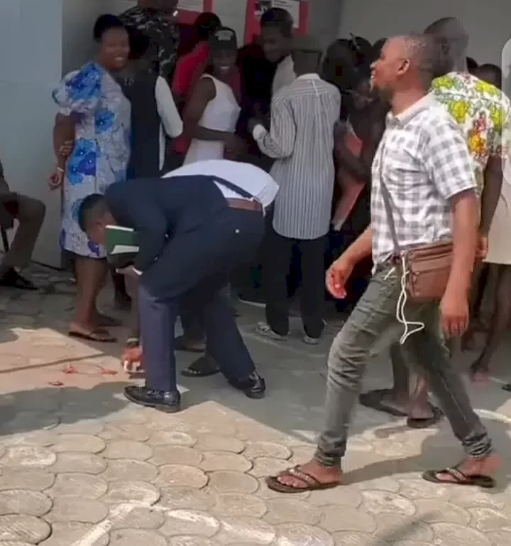 Drama as several packs of condoms fall off Nigeria pastor’s pocket at ATM stand (Video)