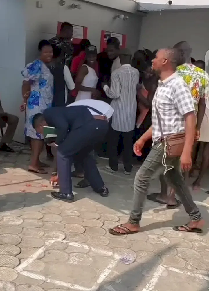 Drama as several packs of condoms fall off Nigeria pastor’s pocket at ATM stand (Video)