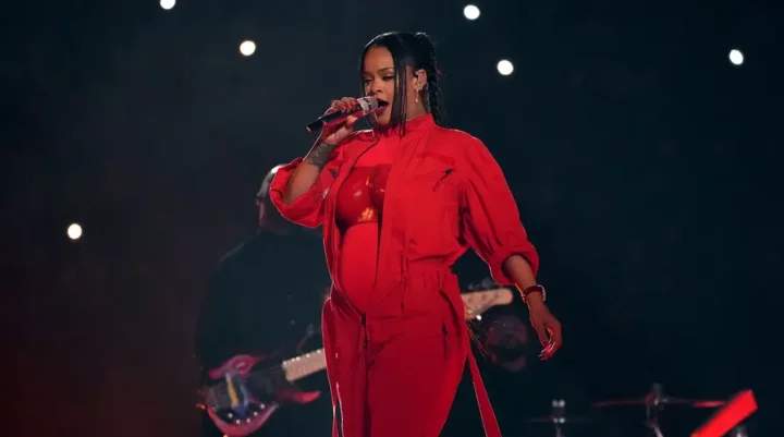 Rihanna pregnant with second child, reveals baby bump during Super Bowl 2023 Halftime Show (Photos/Video)