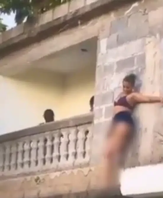 Side chick hides outside balcony to escape sugar daddy’s wife (Video)